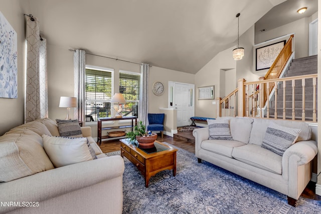 1635 Black Oak Rd, Sparks, NV 89436 - living area with vaulted ceiling, stairs, wood finished floors, and baseboards
