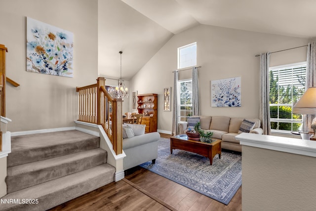 1635 Black Oak Rd, Sparks, NV 89436 - living area with stairway, a chandelier, wood finished floors, high vaulted ceiling, and baseboards