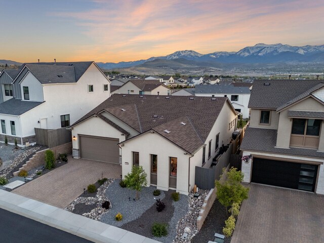 15025 Iron River Dr, Reno, NV 89521 - view of front of home with decorative driveway, a mountain view, and a residential view