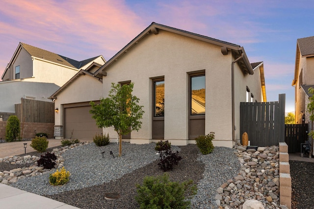 15025 Iron River Dr, Reno, NV 89521 - view of front facade with stucco siding and an attached garage