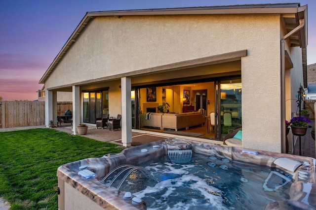15025 Iron River Dr, Reno, NV 89521 - back of property featuring stucco siding, a patio, and a hot tub