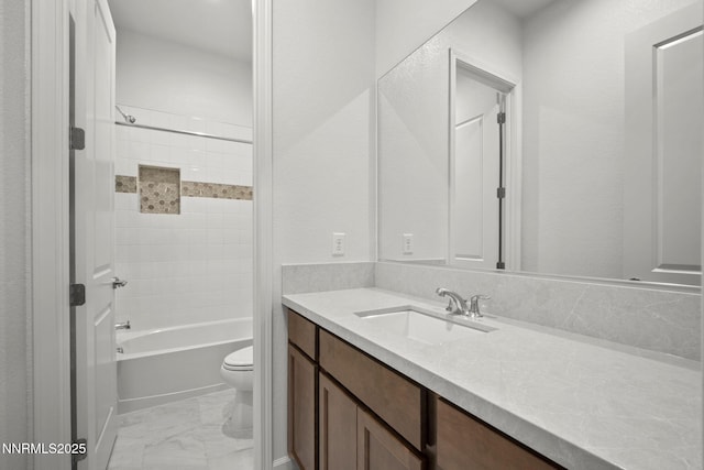 15025 Iron River Dr, Reno, NV 89521 - bathroom with marble look tile flooring, toilet, vanity, and shower / bath combination