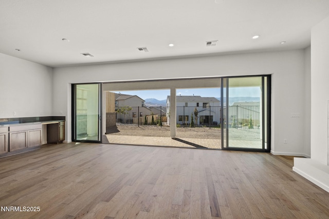 15025 Iron River Dr, Reno, NV 89521 - unfurnished living room featuring wood finished floors, recessed lighting, and baseboards