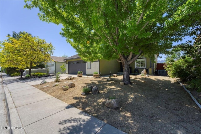5540 Twin Creeks Dr, Reno, NV 89523 - obstructed view of property with central AC unit, a garage, and concrete driveway