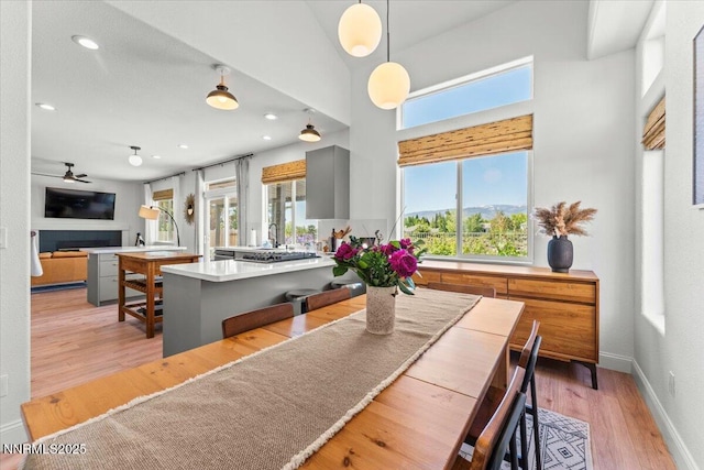 5540 Twin Creeks Dr, Reno, NV 89523 - dining area featuring plenty of natural light, ceiling fan, light wood-style floors, recessed lighting, and baseboards