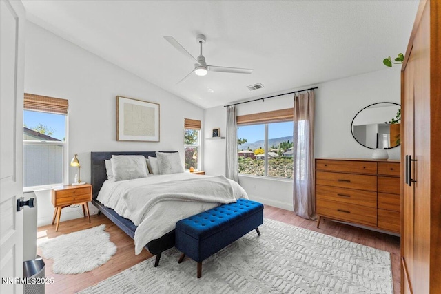 5540 Twin Creeks Dr, Reno, NV 89523 - bedroom with vaulted ceiling, wood finished floors, a ceiling fan, and baseboards