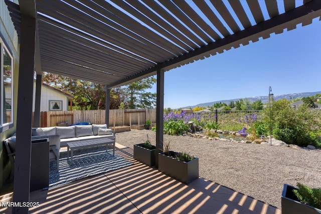 5540 Twin Creeks Dr, Reno, NV 89523 - fenced backyard featuring outdoor lounge area, a patio area, and a mountain view