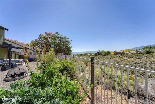 5540 Twin Creeks Dr, Reno, NV 89523 - view of yard with an outdoor fire pit and a mountain view