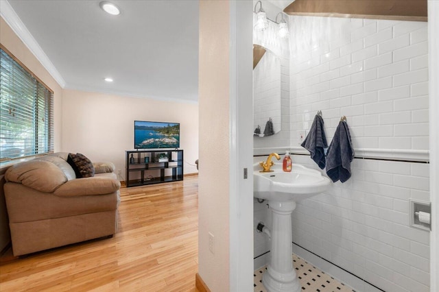 410 Pheasant Dr, Fallon, NV 89406 - bathroom with ornamental molding, wood finished floors, tile walls, a sink, and recessed lighting
