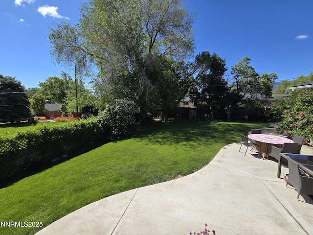 1290 Westwood Dr, Reno, NV 89509 - view of grassy yard featuring a patio area and outdoor dining space