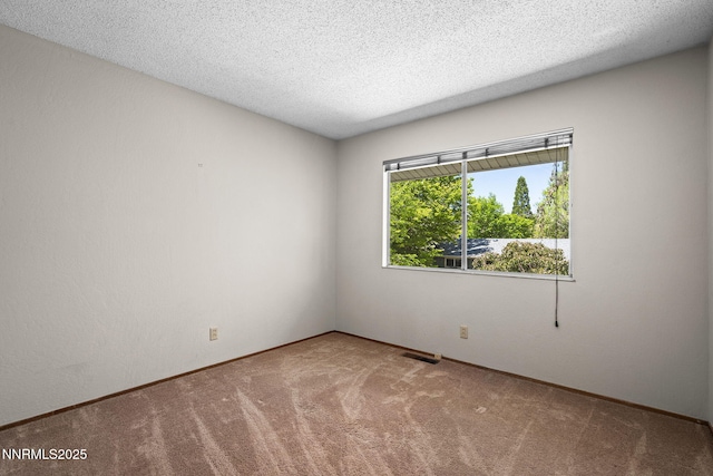 2770 Solari Dr, Reno, NV 89509 - carpeted empty room with a textured ceiling and baseboards