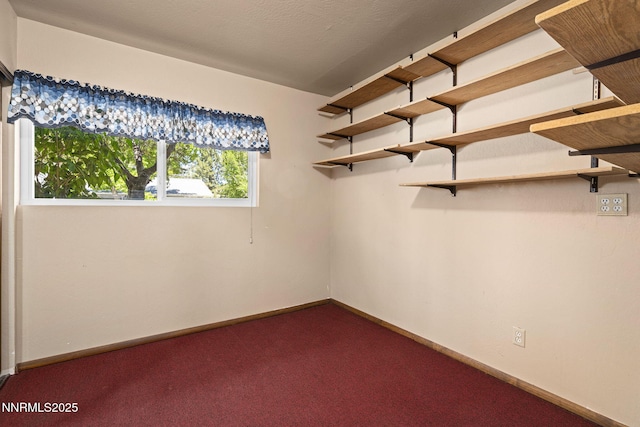 2770 Solari Dr, Reno, NV 89509 - empty room featuring dark colored carpet and baseboards
