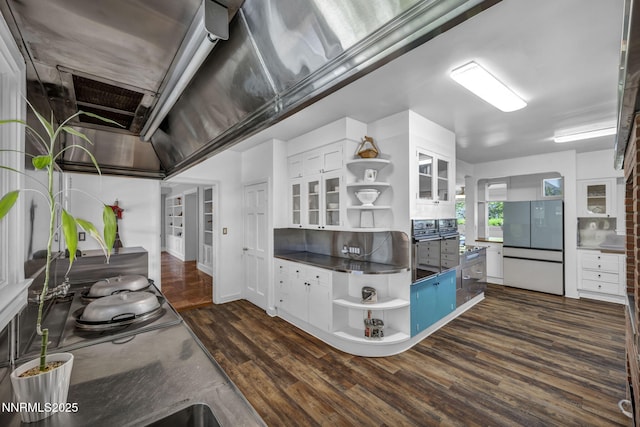 125 Greenridge Dr, Reno, NV 89509 - kitchen with open shelves, dark wood finished floors, dark countertops, white cabinets, and glass insert cabinets