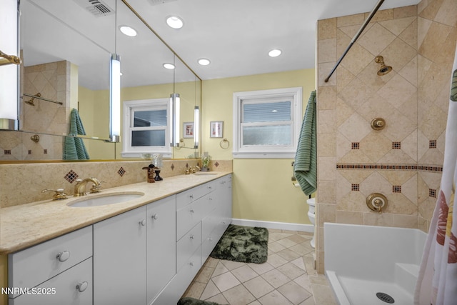 125 Greenridge Dr, Reno, NV 89509 - full bath featuring double vanity, tile patterned floors, a tile shower, baseboards, and toilet