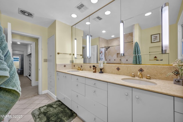 125 Greenridge Dr, Reno, NV 89509 - full bath with double vanity, a shower stall, tile patterned floors, baseboards, and recessed lighting