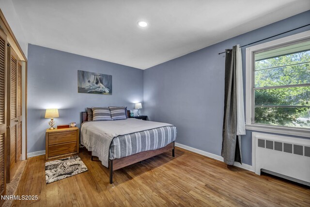125 Greenridge Dr, Reno, NV 89509 - bedroom featuring radiator heating unit, baseboards, wood finished floors, a closet, and recessed lighting