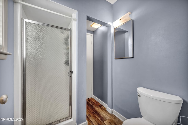 125 Greenridge Dr, Reno, NV 89509 - full bath with wood finished floors, a stall shower, toilet, and baseboards