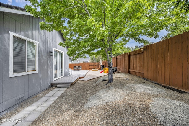 7442 Celeste Dr, Reno, NV 89511 - fenced backyard featuring a wooden deck