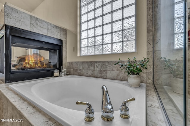 7442 Celeste Dr, Reno, NV 89511 - bathroom with a bath and a multi sided fireplace