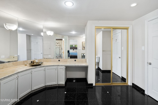 1855 Sierra Sage Ln, Reno, NV 89509 - full bathroom with granite tiled floors, baseboards, recessed lighting, vanity, and toilet
