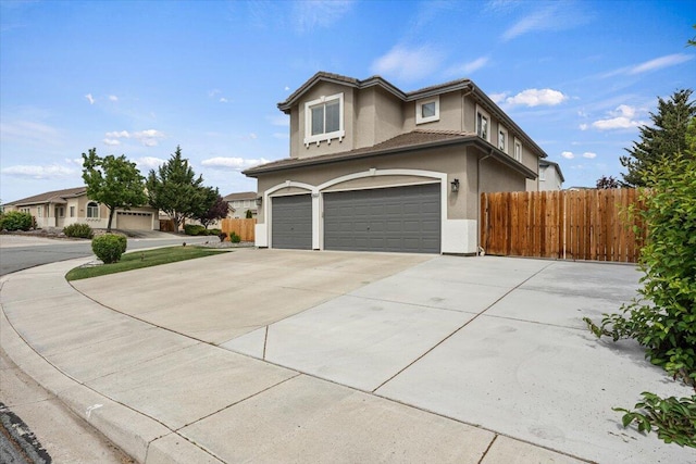 5625 Spandrell Cir, Sparks, NV 89436 - traditional-style house featuring an attached garage, stucco siding, concrete driveway, and a tile roof