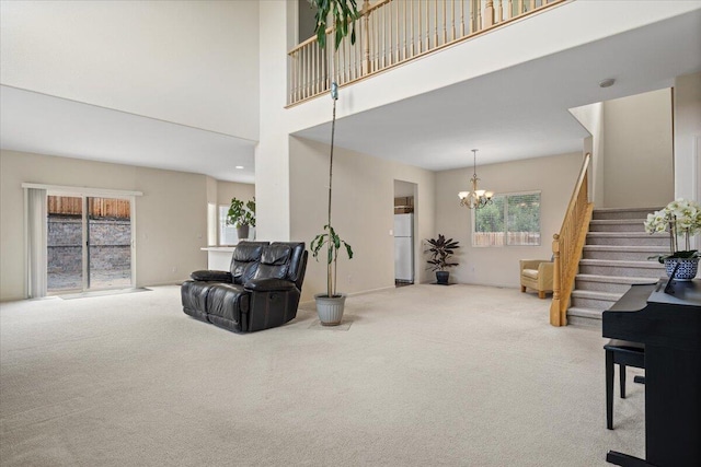 5625 Spandrell Cir, Sparks, NV 89436 - living area featuring carpet, a chandelier, stairway, and a high ceiling