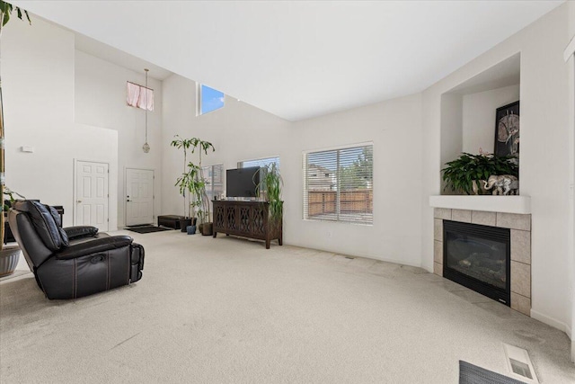5625 Spandrell Cir, Sparks, NV 89436 - living area with carpet flooring, a tiled fireplace, and a high ceiling