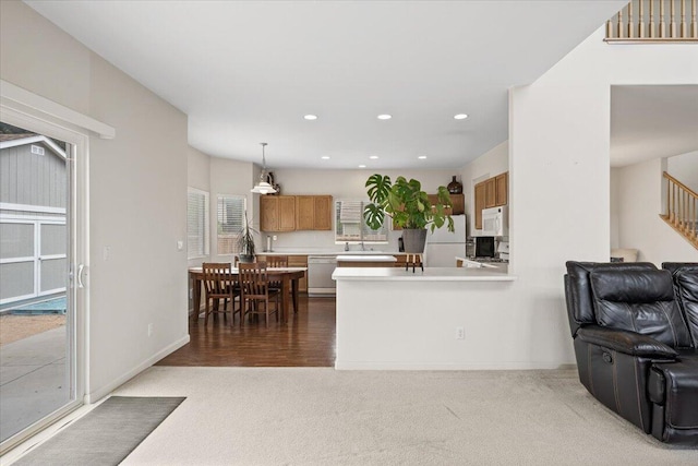5625 Spandrell Cir, Sparks, NV 89436 - kitchen with white appliances, dark carpet, light countertops, open floor plan, and recessed lighting