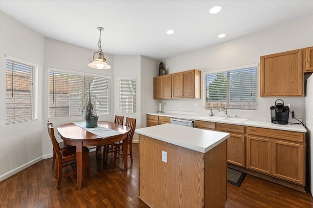 5625 Spandrell Cir, Sparks, NV 89436 - kitchen featuring a sink, dark wood finished floors, light countertops, hanging light fixtures, and recessed lighting