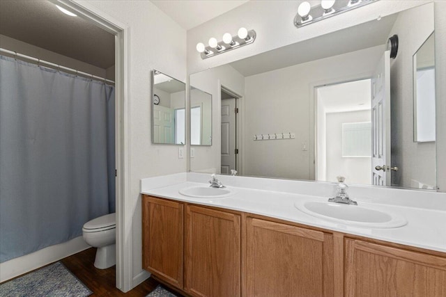 5625 Spandrell Cir, Sparks, NV 89436 - bathroom with toilet, wood finished floors, double vanity, and curtained shower