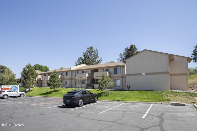 3951 Clear Acre Ln Unit 293, Reno, NV 89512 - view of building exterior with uncovered parking and stairway