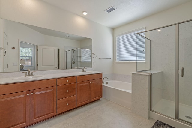 7480 Souverain Ln, Reno, NV 89506 - bathroom with a stall shower, a garden tub, tile patterned floors, and double vanity