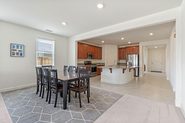 7480 Souverain Ln, Reno, NV 89506 - dining space featuring recessed lighting, baseboards, and light tile patterned flooring