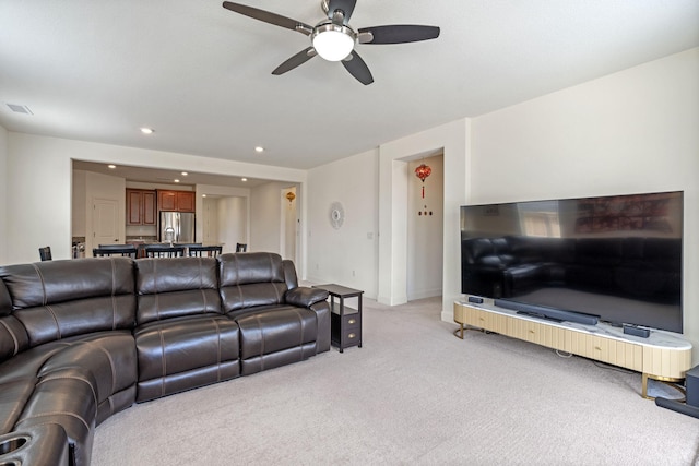 7480 Souverain Ln, Reno, NV 89506 - living area with light carpet, ceiling fan, recessed lighting, and baseboards