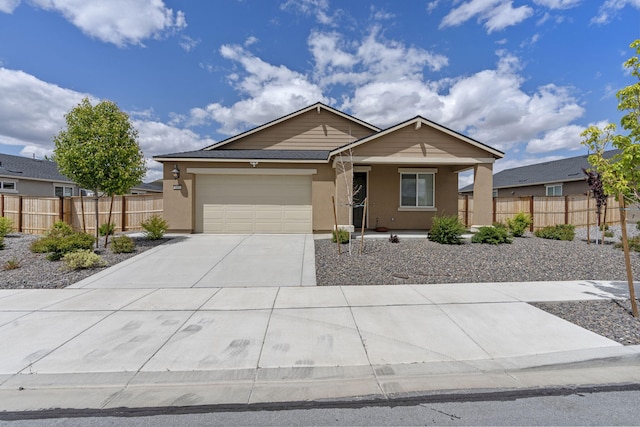 7480 Souverain Ln, Reno, NV 89506 - ranch-style house with driveway, stucco siding, covered porch, and an attached garage