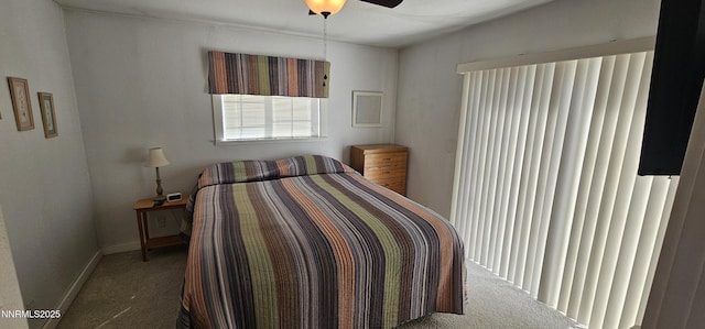 155 James Ct, Kingston, NV 89310 - carpeted bedroom featuring baseboards and a ceiling fan