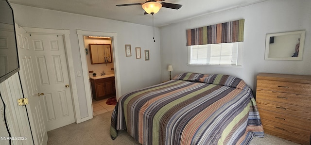 155 James Ct, Kingston, NV 89310 - bedroom featuring light colored carpet, a sink, ensuite bath, light tile patterned floors, and ceiling fan