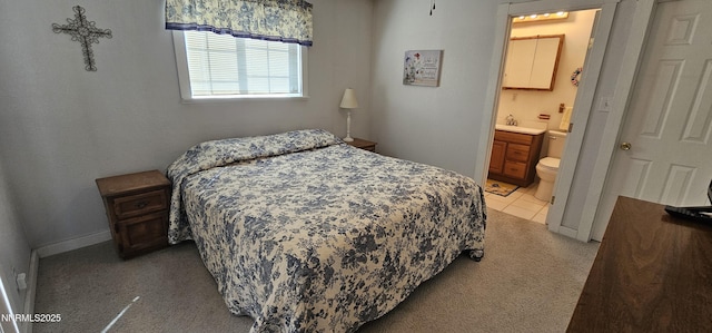 155 James Ct, Kingston, NV 89310 - bedroom with light carpet, ensuite bath, and baseboards