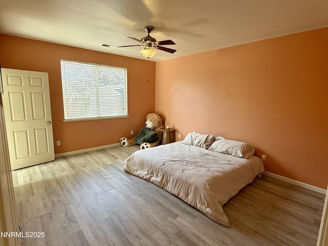 1224 Mountain Rose Dr, Fernley, NV 89408 - bedroom with wood finished floors, baseboards, and ceiling fan