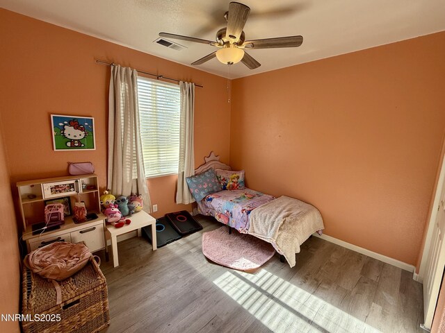 1224 Mountain Rose Dr, Fernley, NV 89408 - bedroom with wood finished floors, ceiling fan, and baseboards