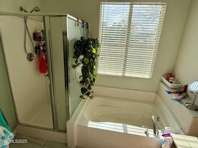 1224 Mountain Rose Dr, Fernley, NV 89408 - bathroom featuring a shower stall, healthy amount of natural light, and a garden tub