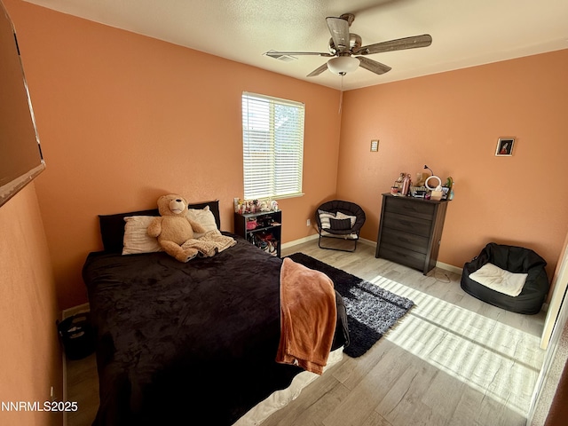 1224 Mountain Rose Dr, Fernley, NV 89408 - bedroom featuring wood finished floors, baseboards, and a ceiling fan