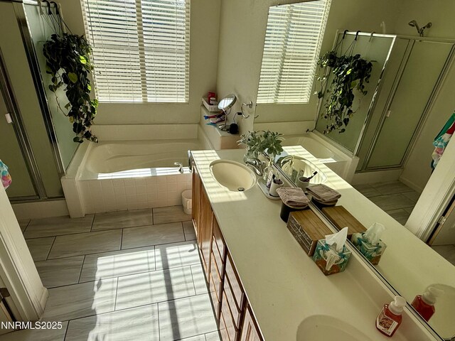1224 Mountain Rose Dr, Fernley, NV 89408 - full bathroom with double vanity, a bath, a stall shower, and healthy amount of natural light