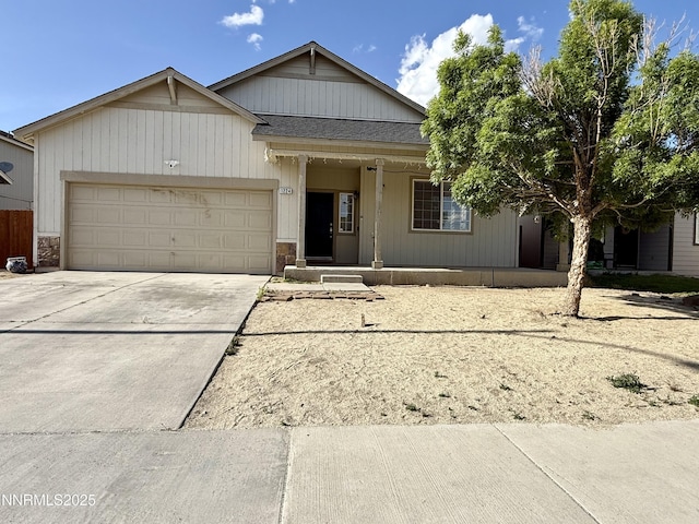 1224 Mountain Rose Dr, Fernley, NV 89408 - view of front of property featuring a garage, a porch, driveway, and roof with shingles