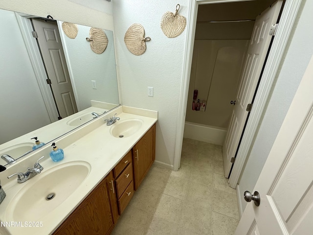 1224 Mountain Rose Dr, Fernley, NV 89408 - bathroom featuring double vanity and baseboards