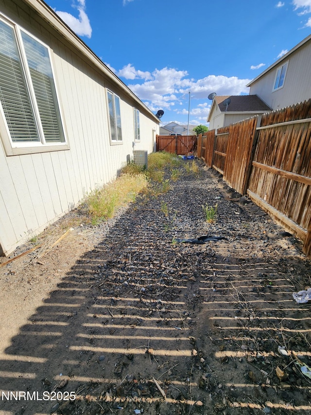 1224 Mountain Rose Dr, Fernley, NV 89408 - fenced backyard featuring cooling unit