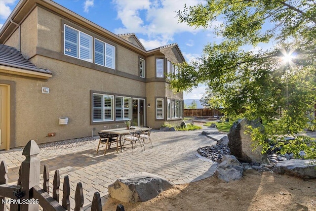 2675 Weymoor Ct, Reno, NV 89521 - rear view of house featuring a patio area and stucco siding