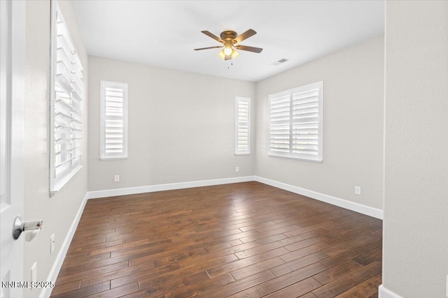 2675 Weymoor Ct, Reno, NV 89521 - spare room featuring a ceiling fan, dark wood-style flooring, and baseboards