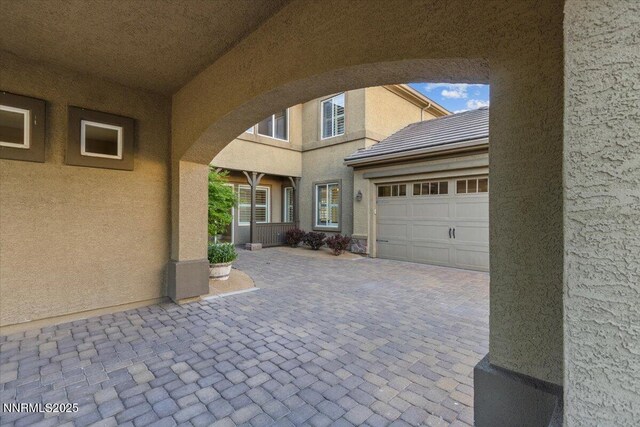 2675 Weymoor Ct, Reno, NV 89521 - view of patio with a garage and decorative driveway