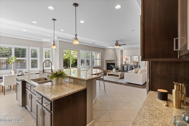 2675 Weymoor Ct, Reno, NV 89521 - kitchen with a sink, dark brown cabinetry, ceiling fan, light tile patterned floors, and recessed lighting